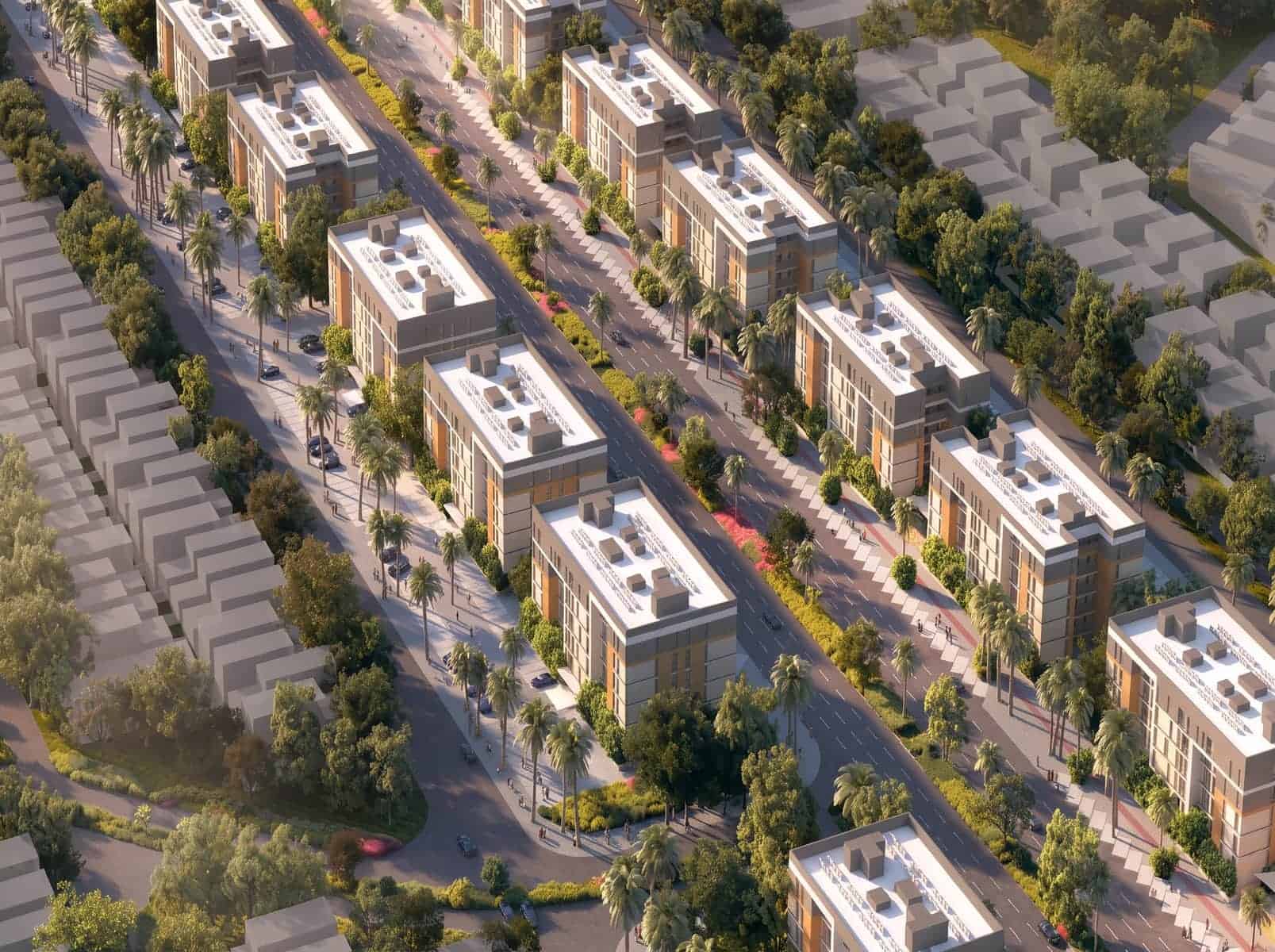 Aerial view of a modern urban development project with multiple buildings and green spaces.